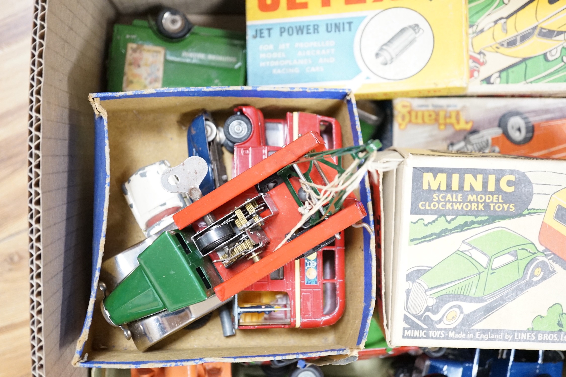 A collection of tin plate model vehicles, to include a boxed Tri-ang model of a Vauxhall Cabriolet & caravan from the Minic clockwork toys collection, and others